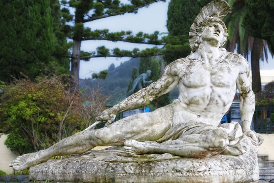 A stone statue of Achilles