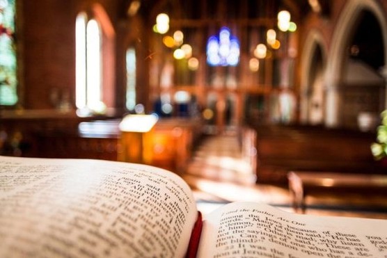 An open Bible on an altar