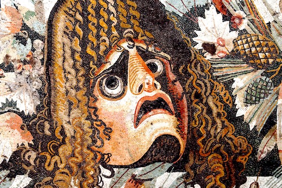 This 1st-century BC mosaic from the House of the Faun in Pompeii depicts a tragic dramatic mask, a powerful symbol of Roman theatrical culture. Masks like this were central to performances, allowing actors to embody gods, heroes, and emotions on stage.