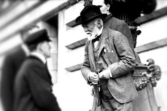Andrew Carnegie (1835–1919), the Scottish-American industrialist who built a steel empire in the late 19th century, speaks with colleagues in this photograph. Renowned for both his business success and later philanthropy, Carnegie championed education, libraries, and scientific advancement as part of his belief in the philanthropy. (Photo by Getty Images)
