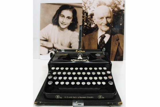 Photographs of Anne Frank and her father, Otto, with the typewriter