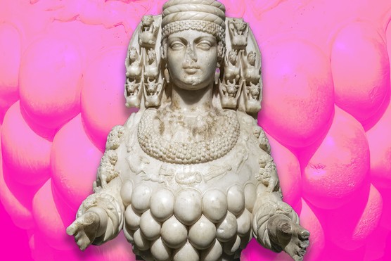 A large marble statue of a woman, with many bulbous growths all over her front