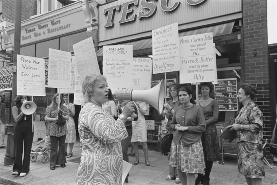 Inflation hit Britain hard in the 1970s. Here activist Erin Pizz addresses a protest by housewives holdiing placards decrying rising food prices in July 1971