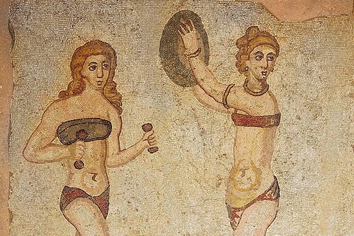 Detail of the Ten Girls Mosaic depicting women athletes This detail from the 'Ten Girls' mosaic at the Villa del Casale in Piazza Armerina shows young women training with hand weights and a discus. Dating to the early 4th century AD, the scene highlights the place of athletic exercise in elite Roman life.