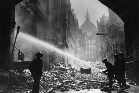 Firemen tackling a blitz fire at St Paul's Cathedral, London