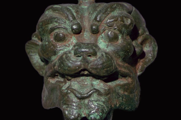 This bronze head of Pazuzu, likely from Nimrud and dating to the Neo-Assyrian period (c. 800–550 BC), represents one of Mesopotamia’s most striking supernatural figures. Though a fearsome demon associated with destructive winds, Pazuzu also served as a powerful protector, warding off the deadly forces — especially the demoness Lamashtu — believed to threaten mothers and infants.