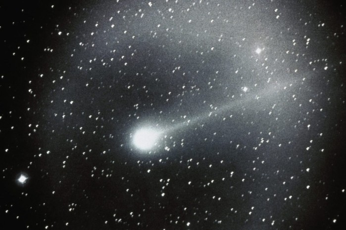 Halley’s Comet streaks across the sky in this 1986 photograph taken from the Ford Observatory, marking its most recent visit to the inner solar system. Once feared as a portent of upheaval, the comet is now a predictable visitor whose returns chart centuries of astronomical discovery.