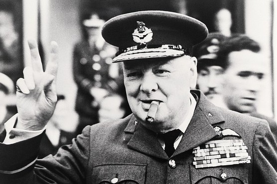Winston Churchill making the famed ‘V’ for Victory sign. (Image by Bettmann/Getty Images)