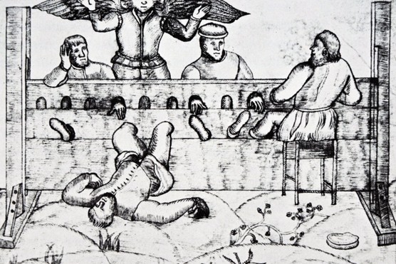 A woodcut print depicting the stocks, a form of Elizabethan punishment. Dated 16th century. (Photo by: Universal History Archive/UIG via Getty Images)