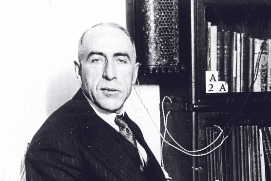 In December 1929, investigator and ghost hunter Harry Price demonstrates an electric control device he designed to monitor a medium’s movements during séances. (Photo by Alamy)