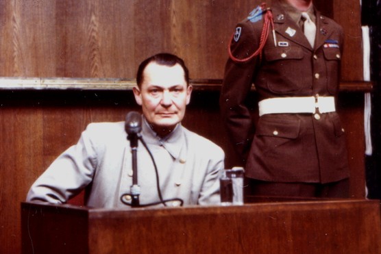 Hermann Göring testifies in his own defense at the Nuremberg Trials in 1946. Once a leading figure of the Nazi regime, Göring faced prosecution alongside other high-ranking officials for war crimes and crimes against humanity in the aftermath of the Second World War.