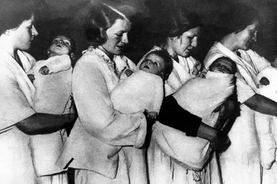 German women carrying children believed to be part of the Lebensborn programme