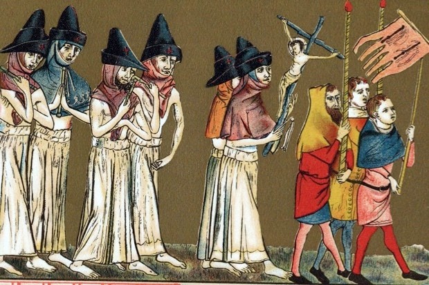 Flagellants or Brothers of the Cross in Netherlands scourging themselves as they walk through streets