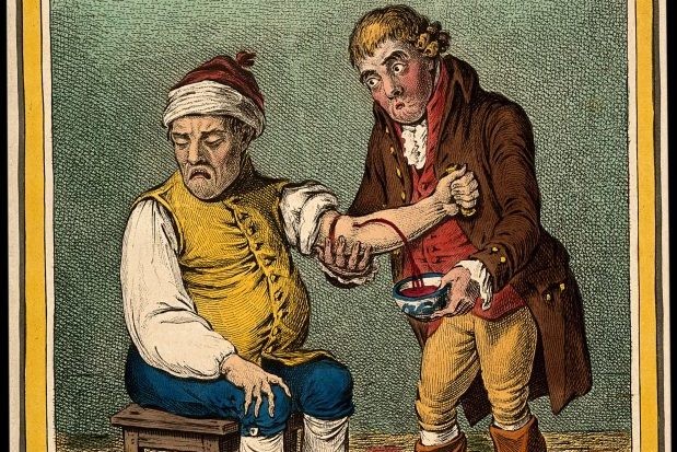 Doctor bleeding a patient