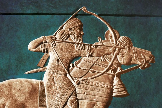 This stone relief from the palace of Ashurbanipal at Nineveh (668–627 BC) shows the Assyrian king leading a lion hunt — a dramatic display of dominance that reinforced royal authority in the Late Assyrian Empire.