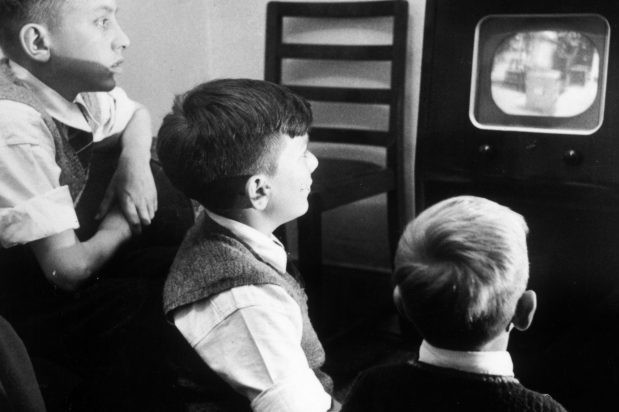 Boys watching TV in the 1950s